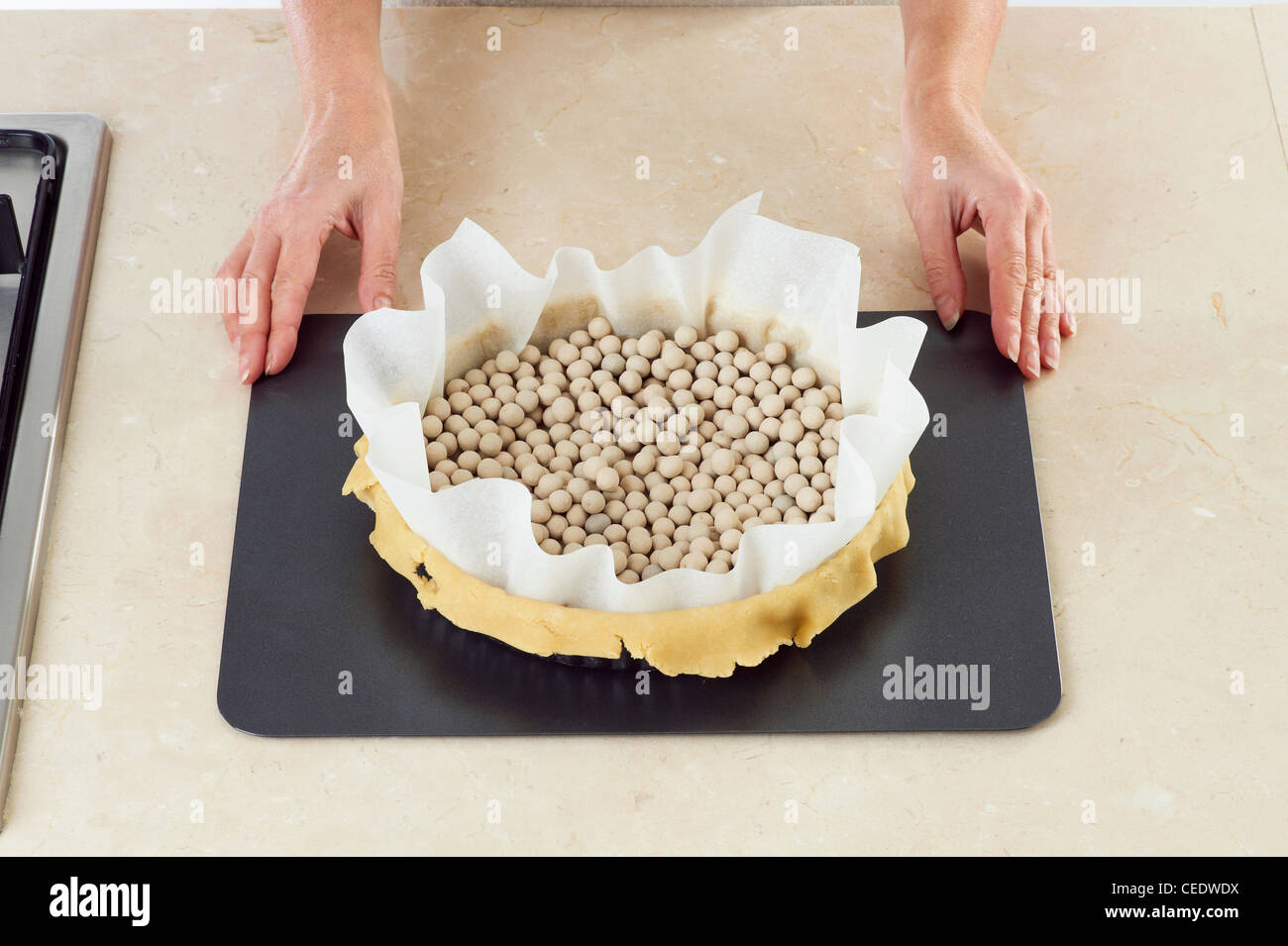 Baking beans in tart tin Stock Photo Alamy