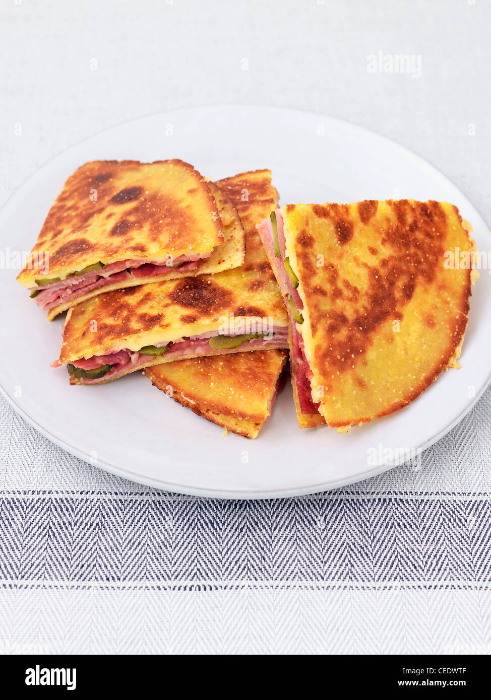 Quesadilla with ham, gherkin, and smoked cheese Stock Photo Alamy