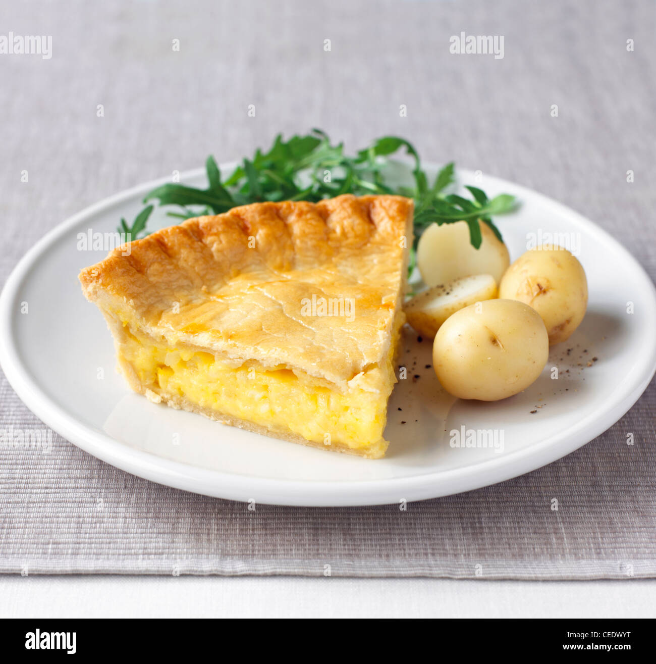 Cheese and onion pie with boiled potatoes Stock Photo