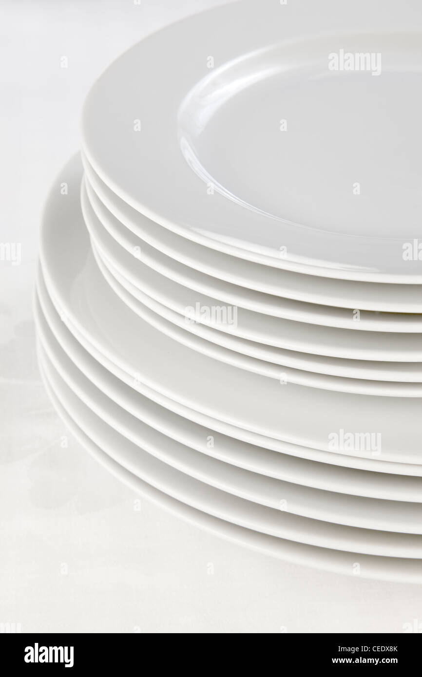 stack of white plates Stock Photo