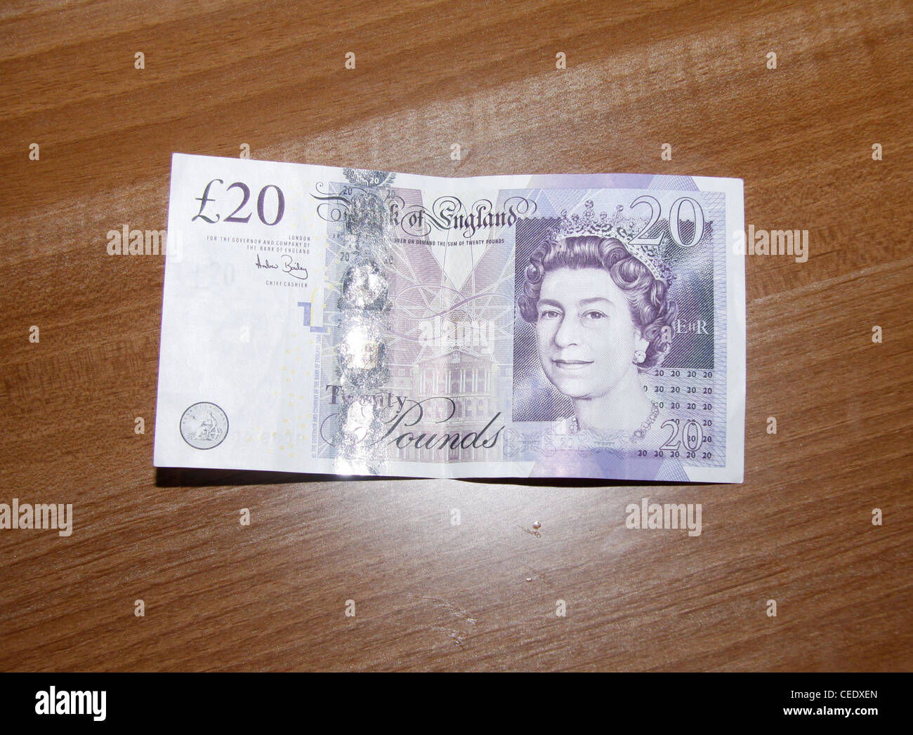 £20 note wood background Stock Photo - Alamy
