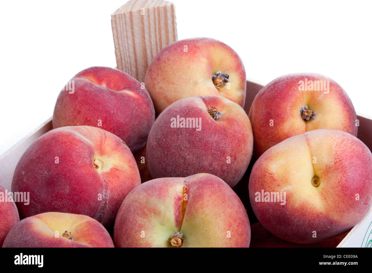 Detail of a crate of peaches isolated Stock Photo Alamy