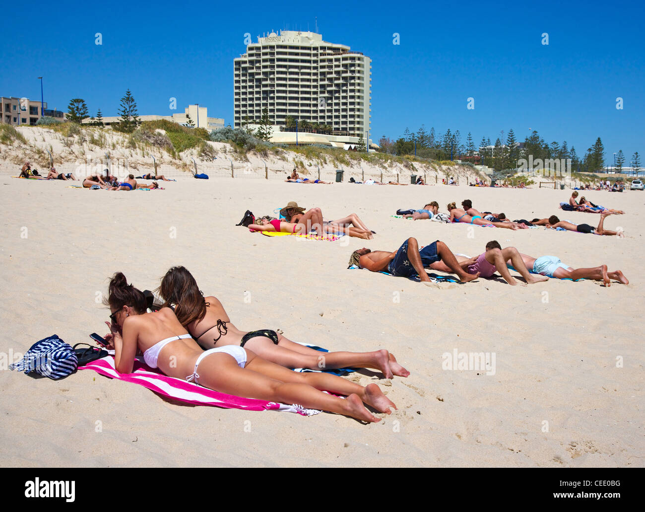 Sun bathers on Scarborough beach near Perth Western Australia Stock Photo