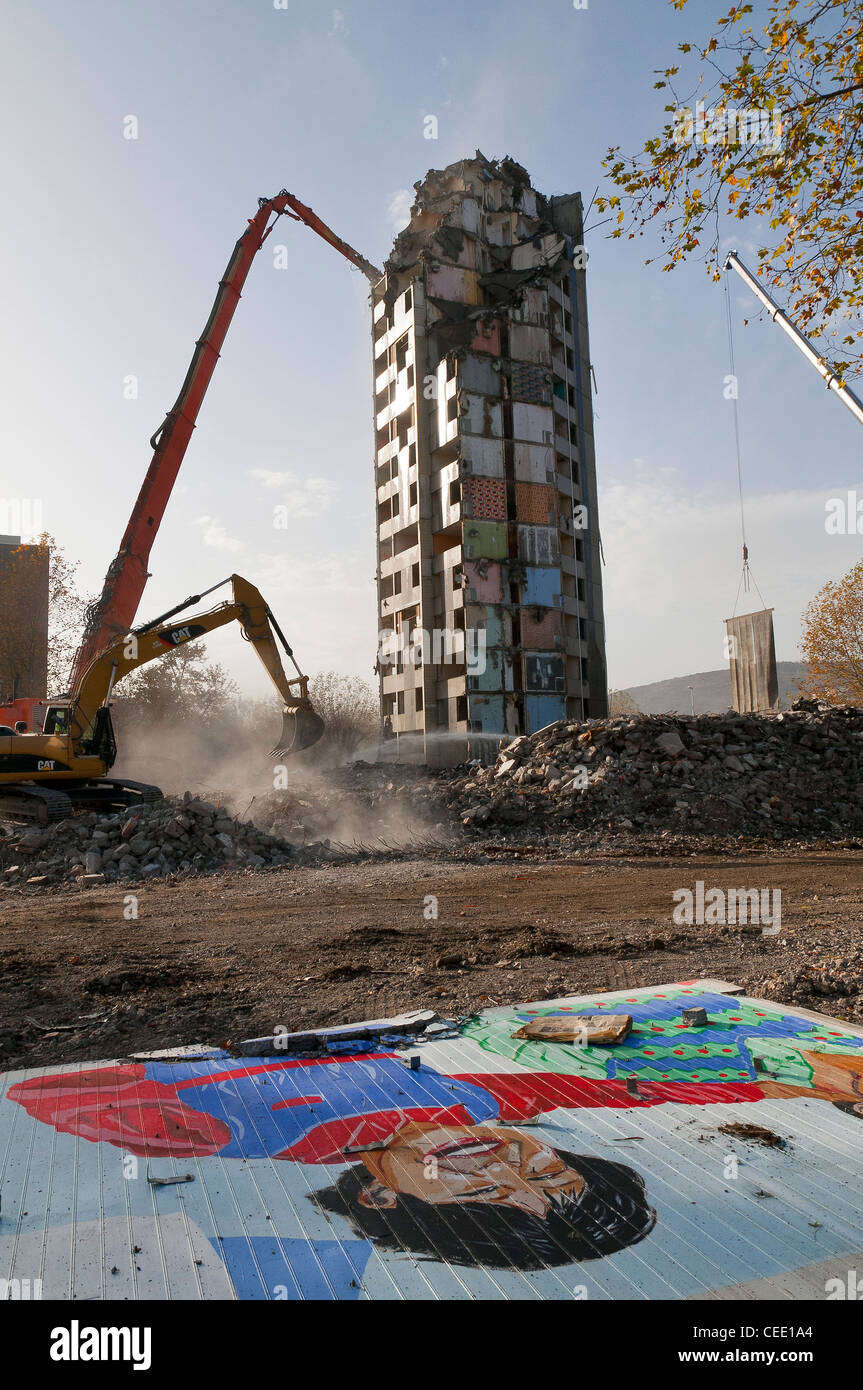 three excavators in action on a building demolition site of HLM building, France Stock Photo