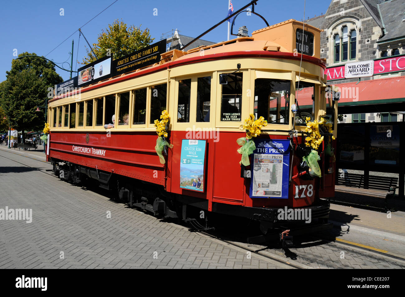 A vintage city tram at a tram stop in Worcester Street, Christchurch, New Zealand Stock Photo