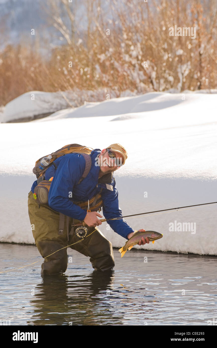 A fly fisherman fishes the Big Wood River in Ketchum, Idaho in winter
