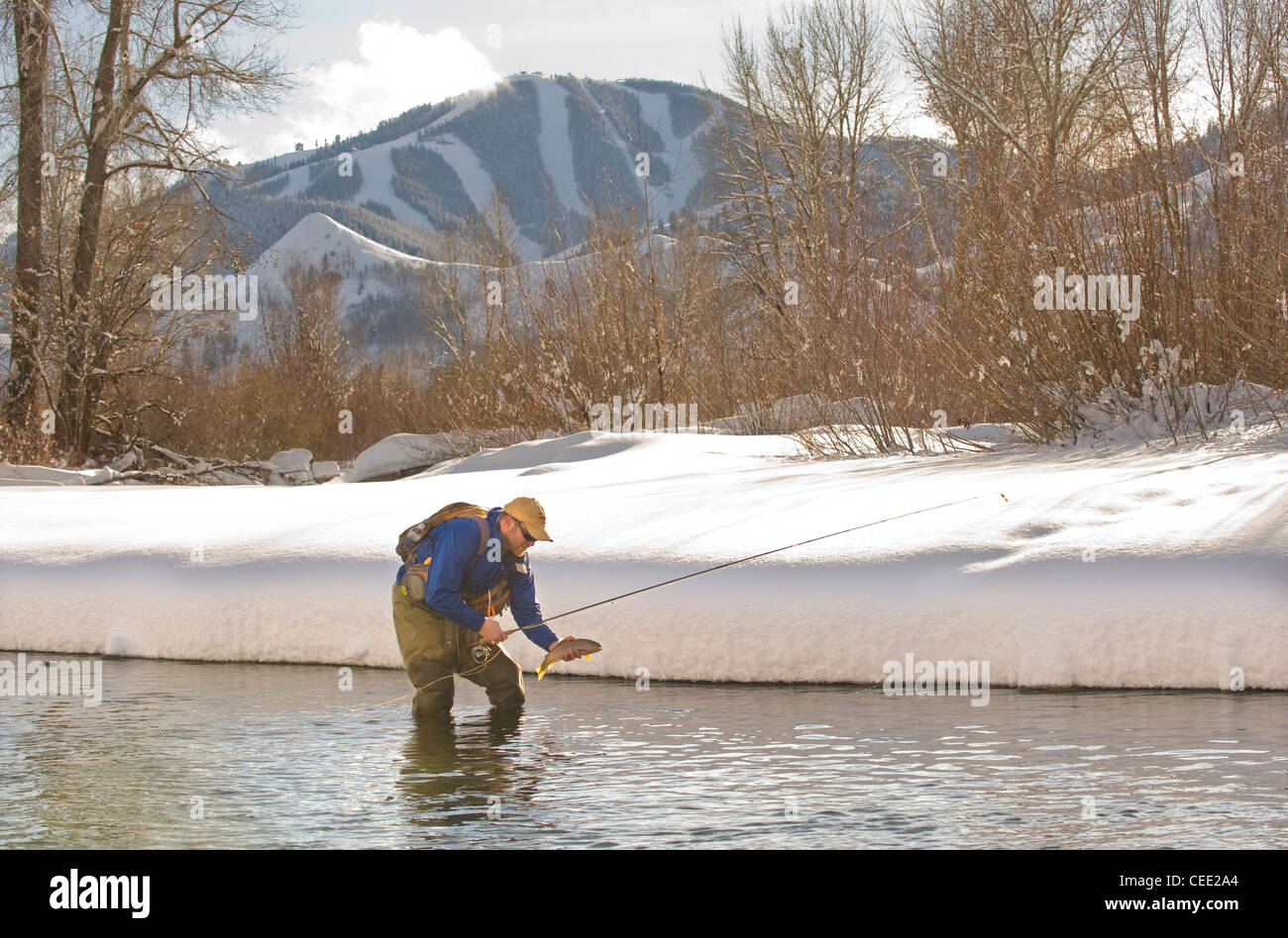 A fly fisherman fishes the Big Wood River in Ketchum, Idaho in winter
