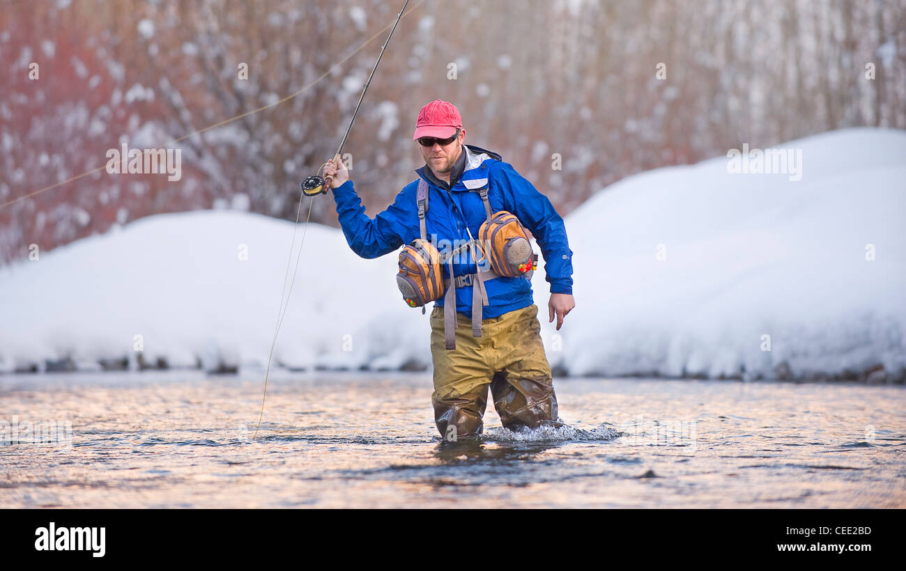 A fly fisherman fishes the Big Wood River in Ketchum, Idaho in winter