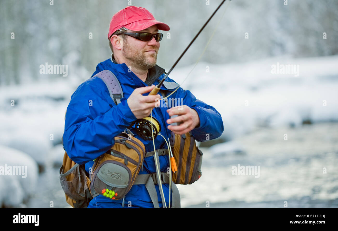 A fly fisherman fishes the Big Wood River in Ketchum, Idaho in winter