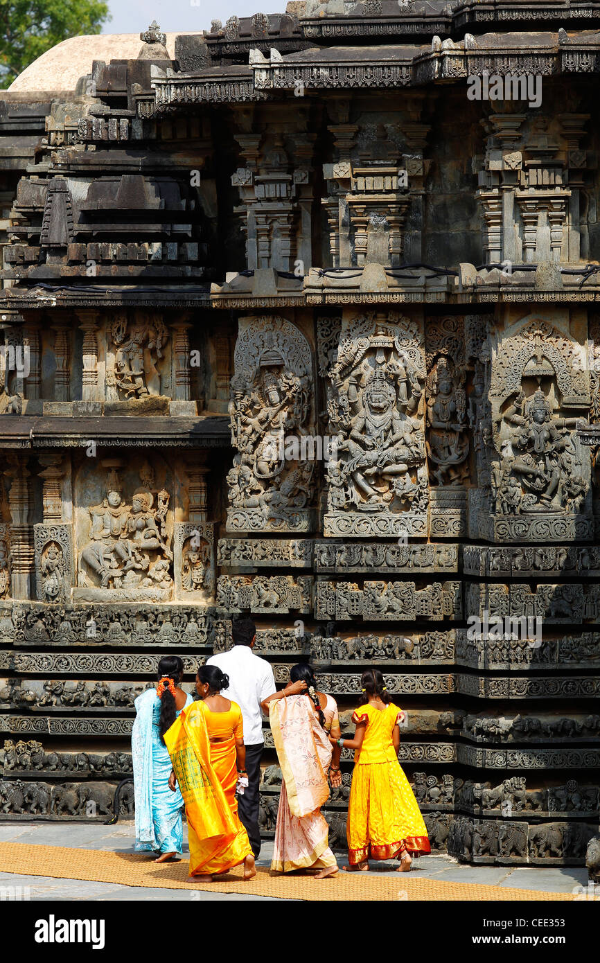 Indian womans in traditional clothes visiting Hoysaleswara temple, a