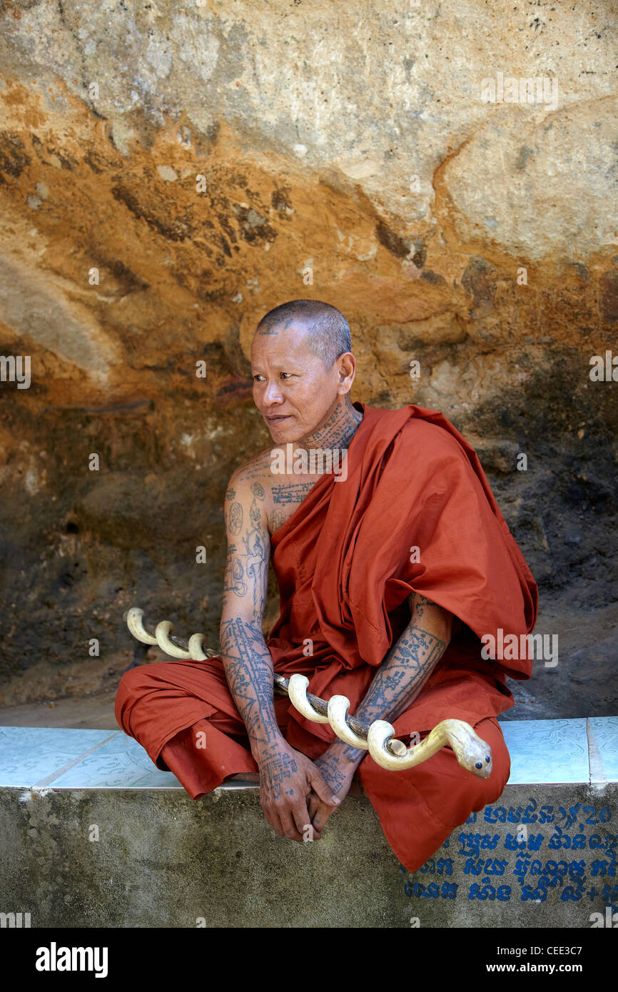 Buddhist monk in Cambodia with tattoo and shaved head Stock Photo