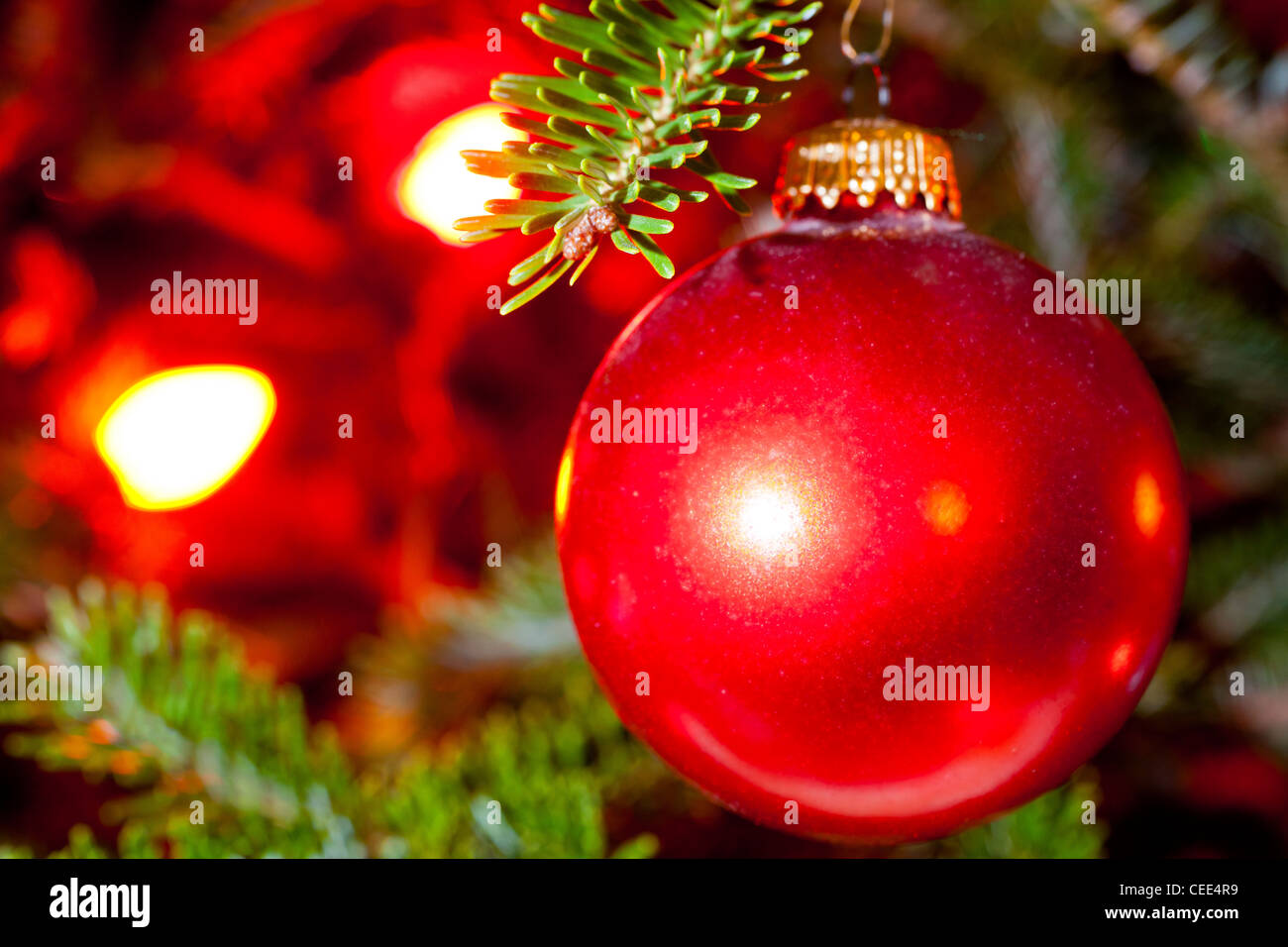 A Christmas ornament hangs on a Christmas tree. Stock Photo