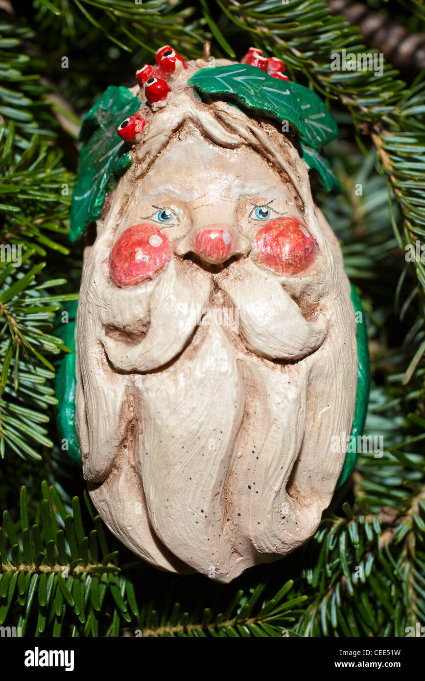 A Christmas ornament hangs on a Christmas tree. Stock Photo