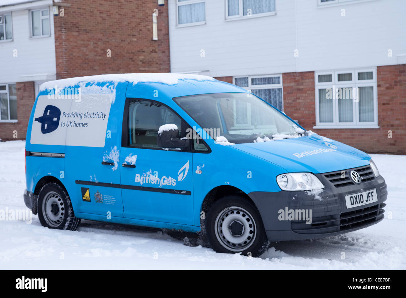 A British Gas Centrica energy supplier engineers van parked outside a residential house in the snow Nottingham England UK Stock Photo
