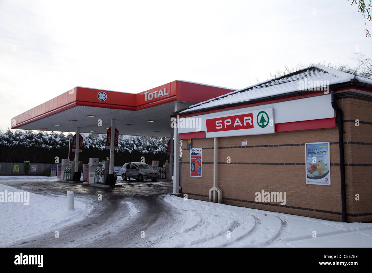 TOTAL petrol station forecourt with SPAR supermarket on a winters day Nottingham England UK Stock Photo