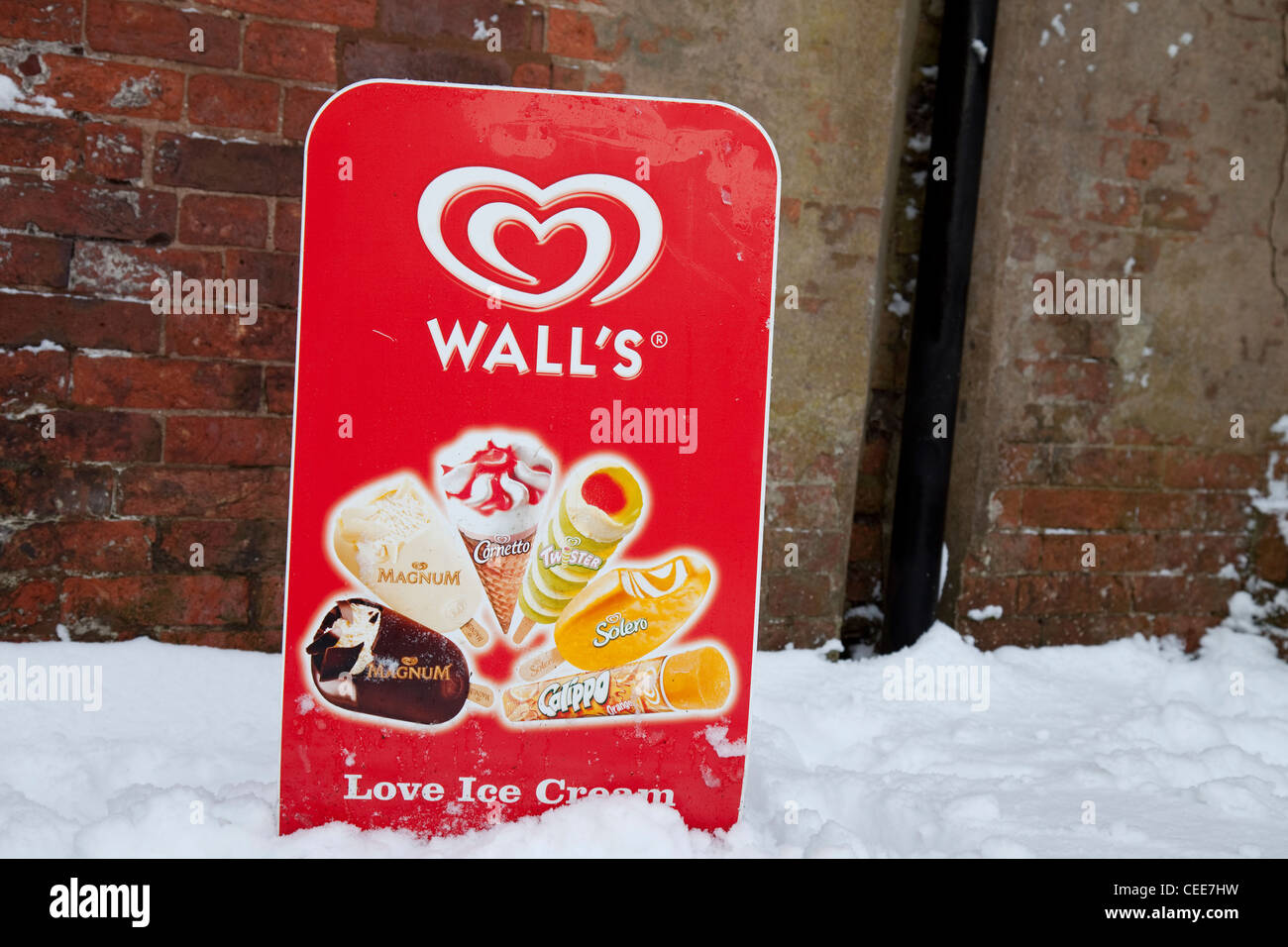 A Wall's ice cream street sign in snow Nottingham England UK Stock