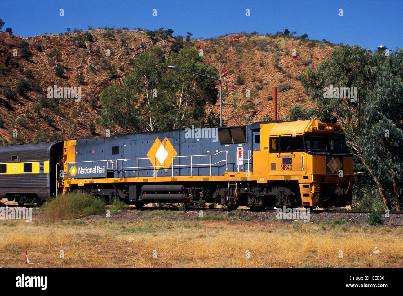 The Ghan train heading south through Heavitree Gap, Alice Springs, Central Australia, circa 2008. Rolling stock now wears current operator's livery. Stock Photo