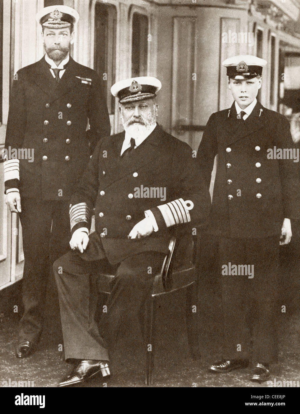 From left, Prince of Wales, later King George V, King Edward VII, seated, and Prince Edward, later Edward VIII. Stock Photo