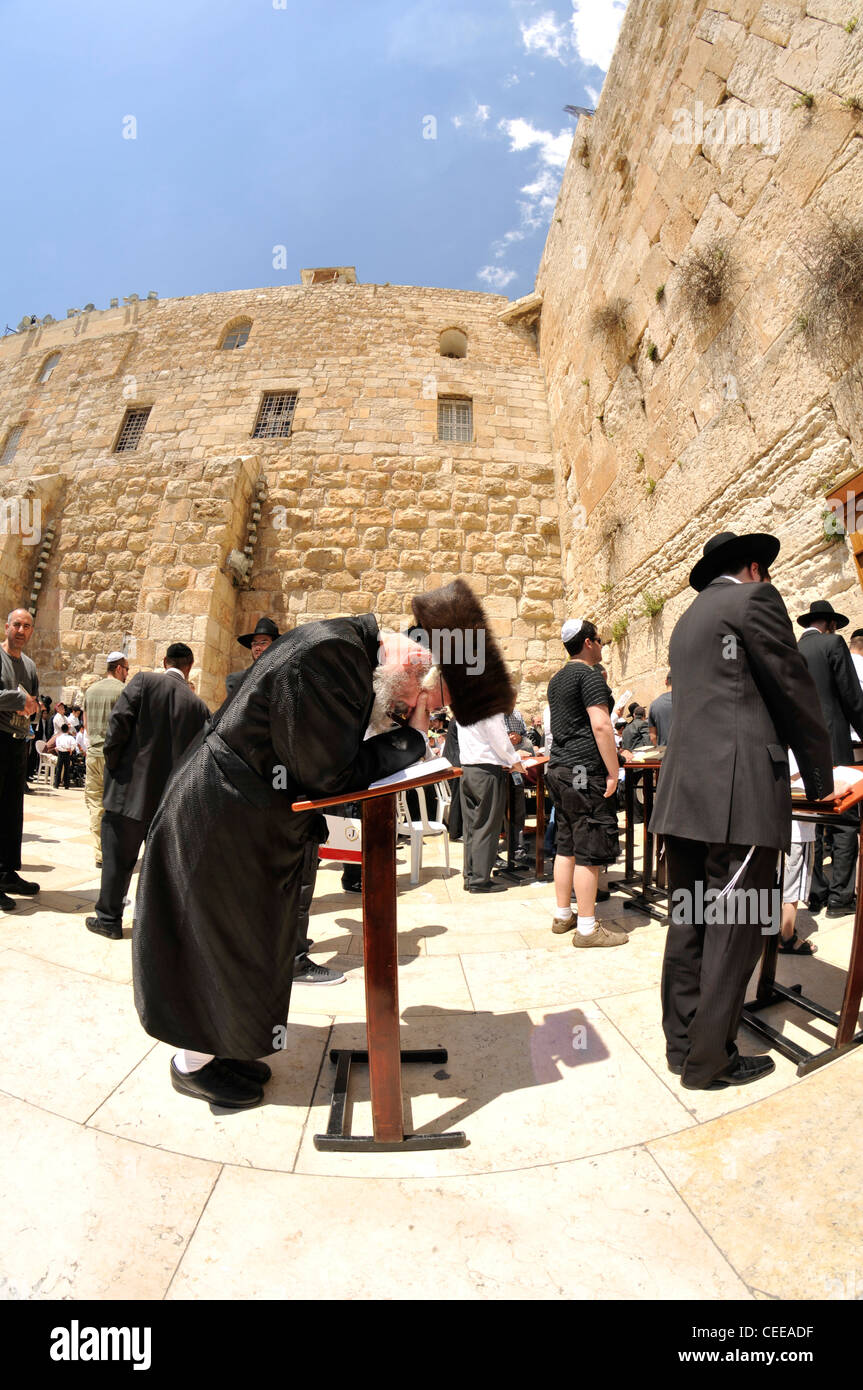 Jewish prayers and pilgrims beside Western Wall in Jerusalem, Israel. Stock Photo
