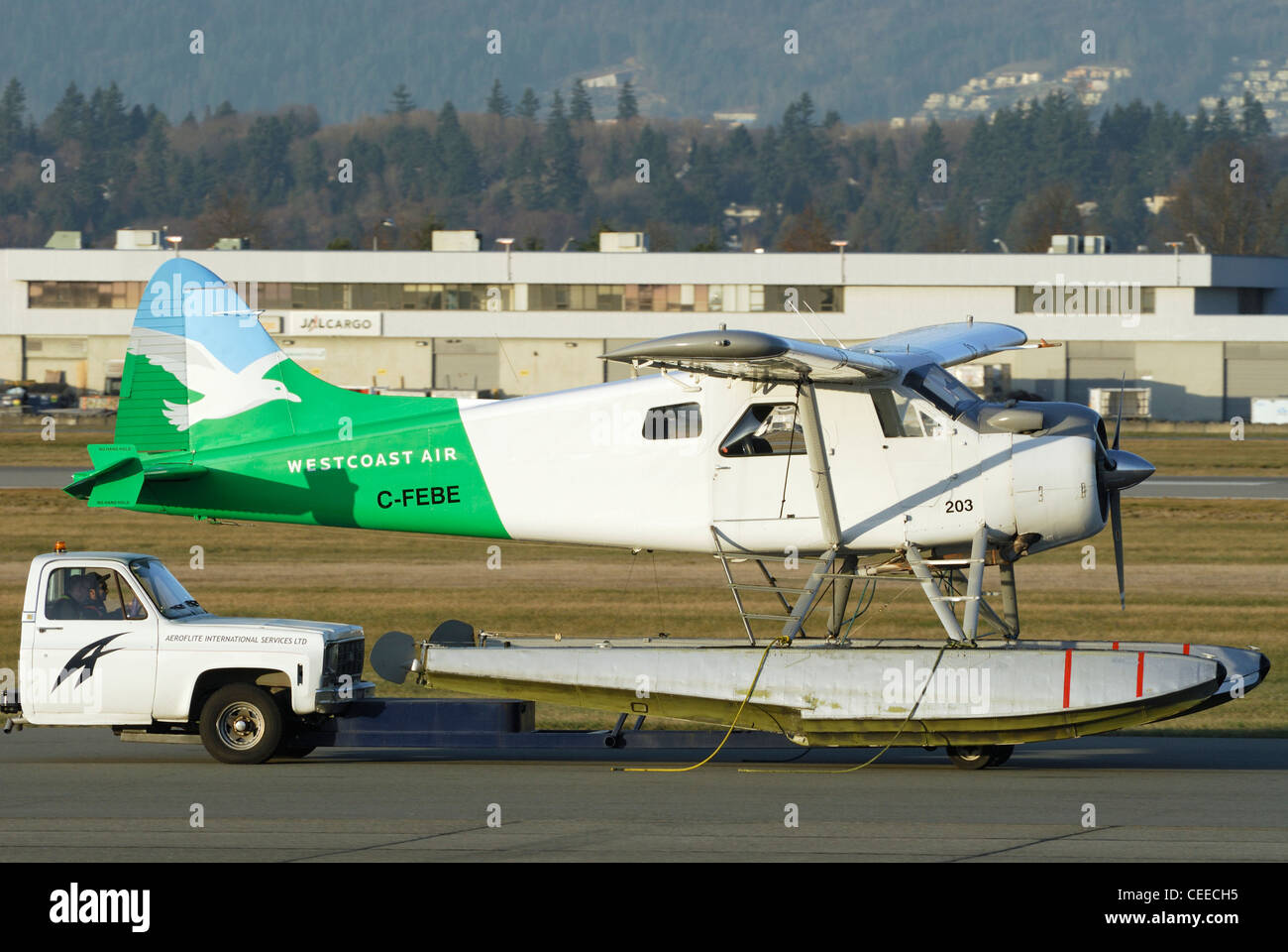 Westcoast Air C-FEBE De Havilland DHC-2 Beaver MK1 being towed by truck at Vancouver International Airport. Stock Photo