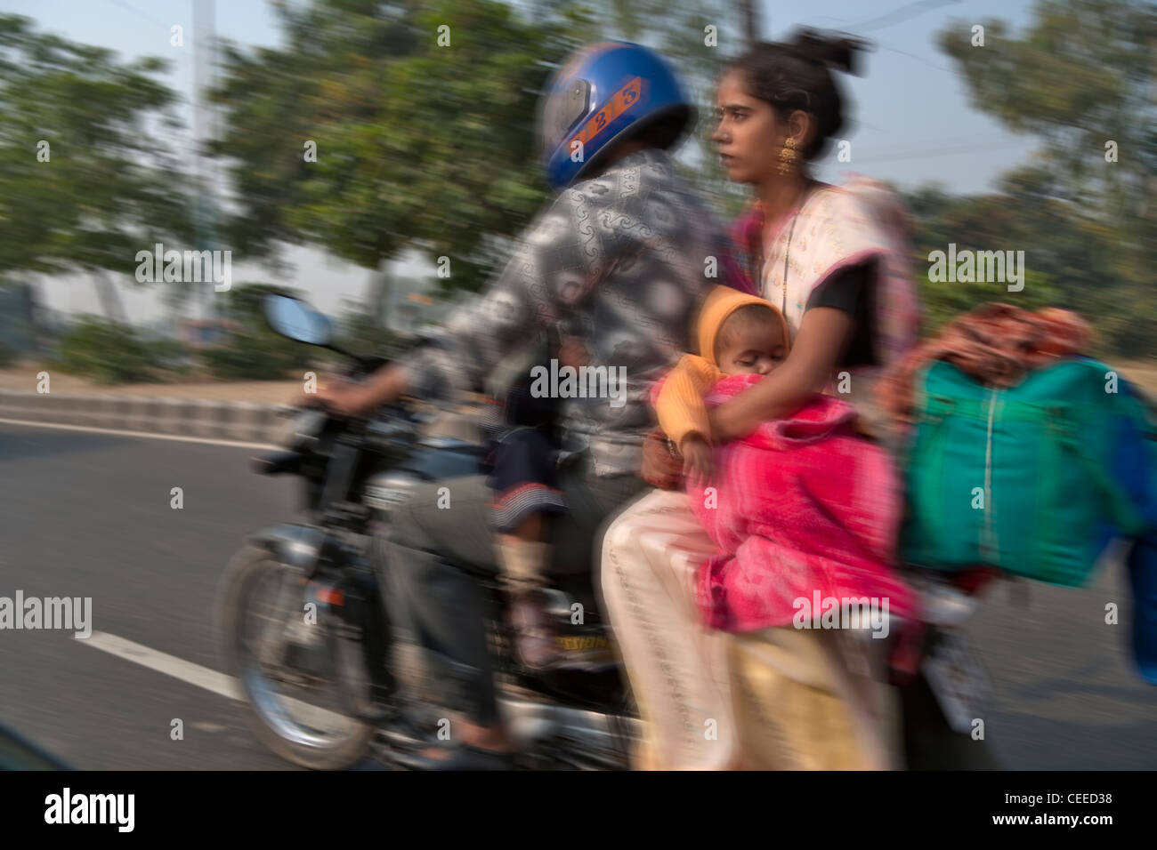 Family of four people travel on motorbike, Agra, India Stock Photo