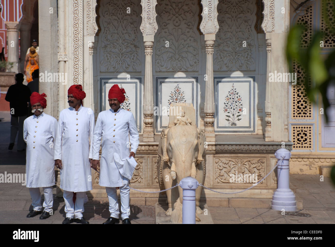 Guards in traditional dress an the entrance to the City Palace, Jaipur, Rajasthan, India Stock Photo