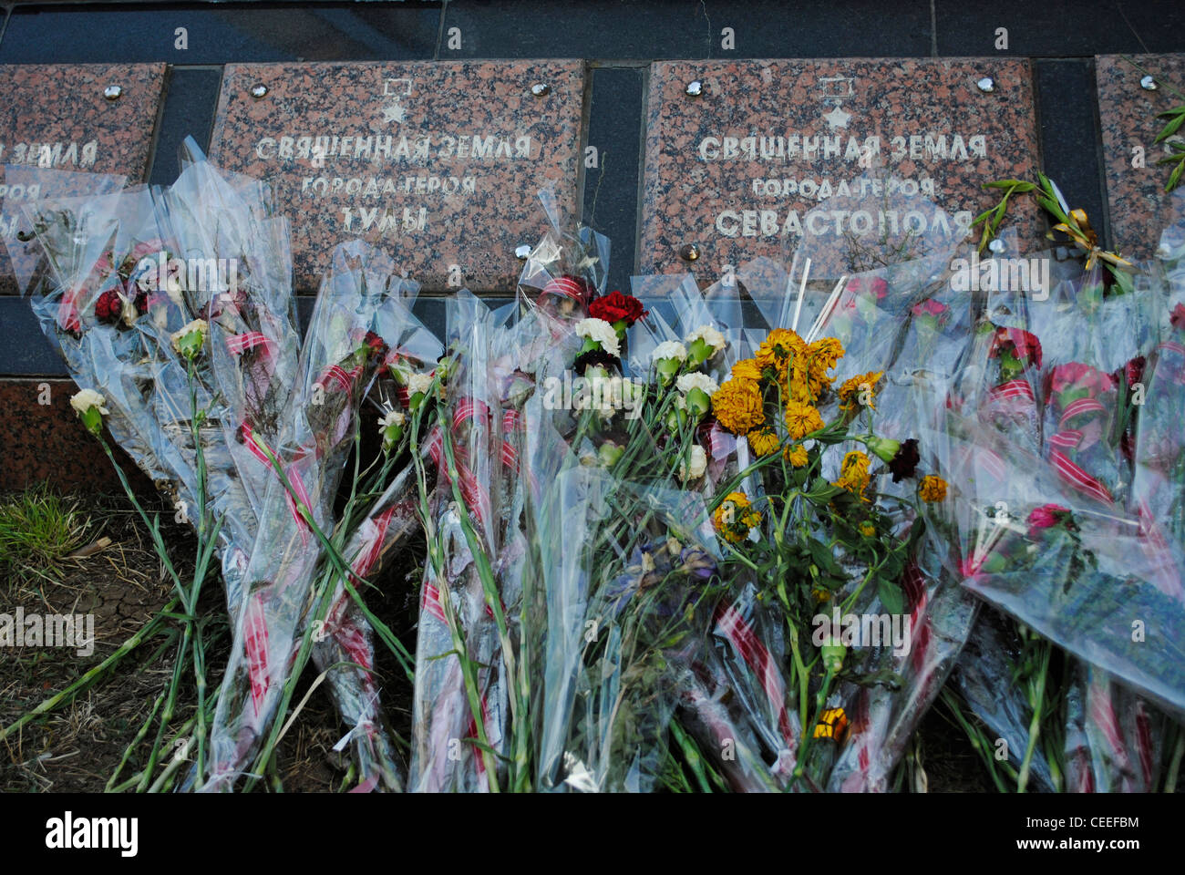 Ukraine. Autonomous Republic of Crimea. Feodosiya. Memorial to Victims of World War II. Floral offerings. Stock Photo