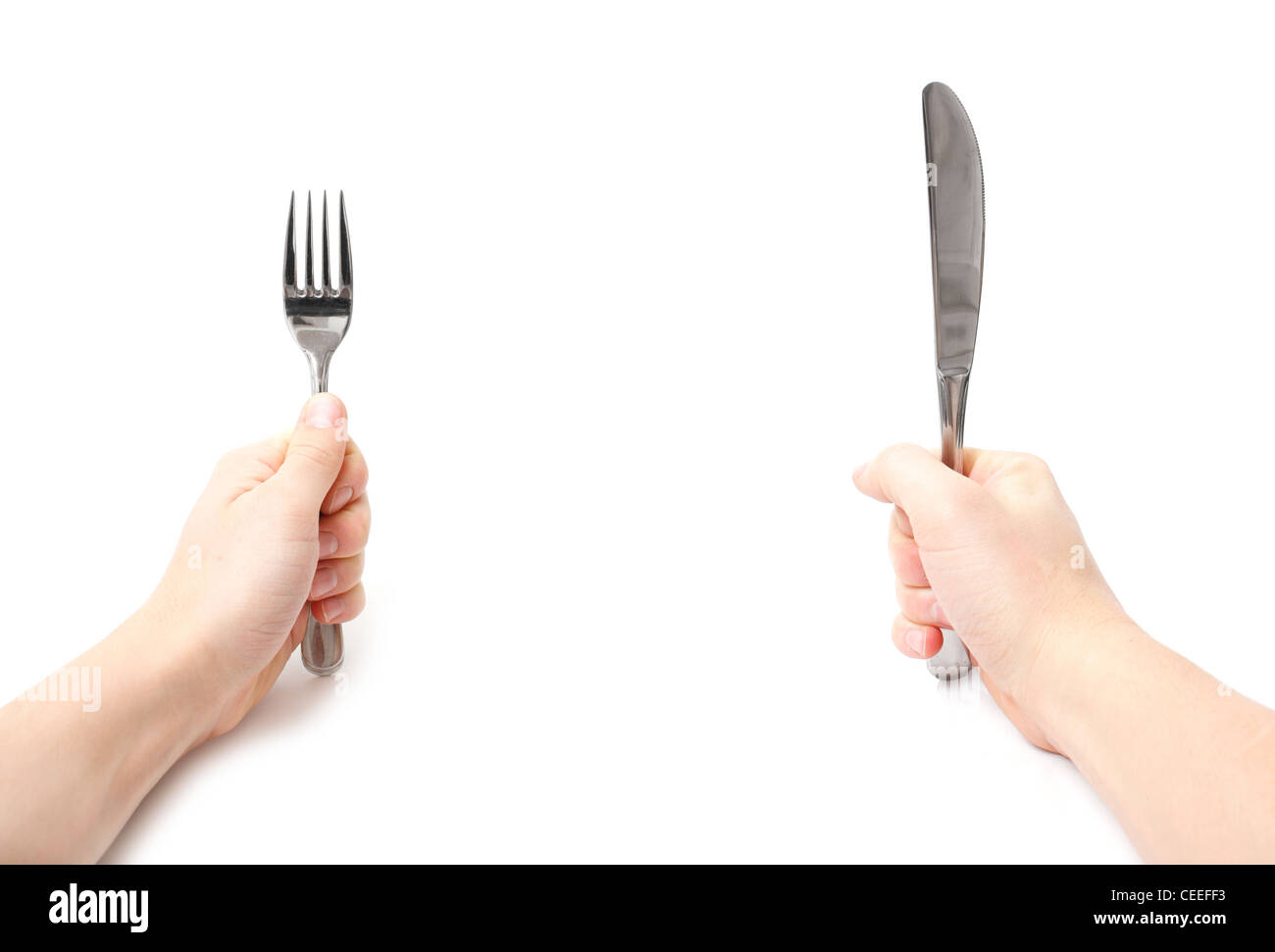 Hands holding knife and fork Stock Photo Alamy