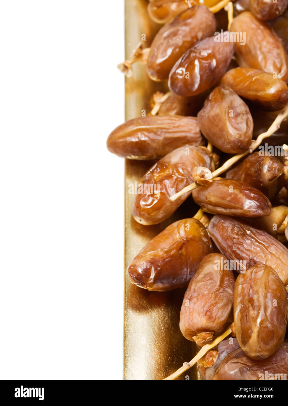 Dried dates on the tray, white background Stock Photo