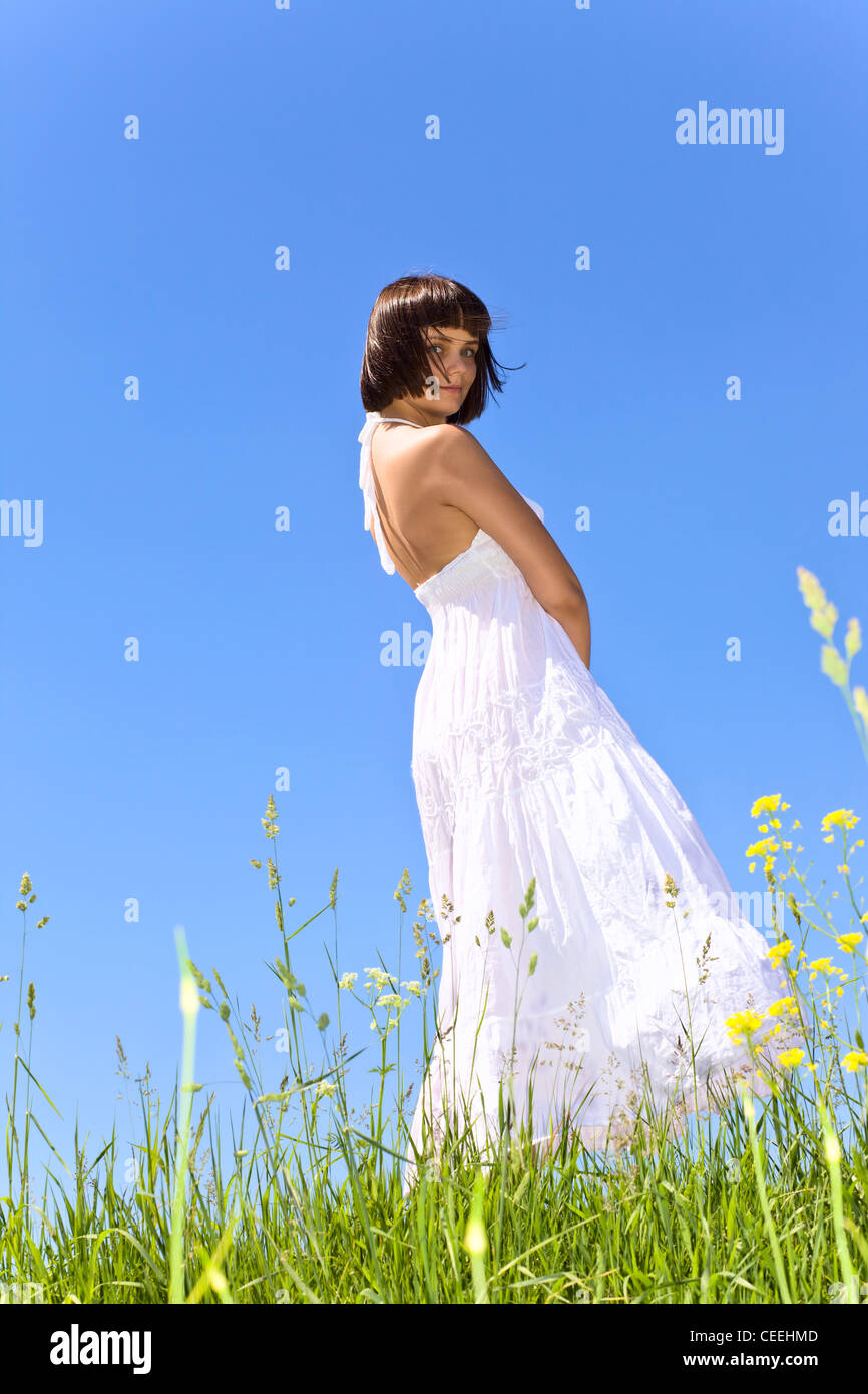 Young girl on a meadow in white dress Stock Photo - Alamy