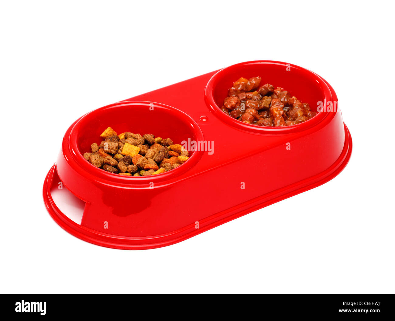 Cat bowls with wet food and dry biscuits food on white background Stock