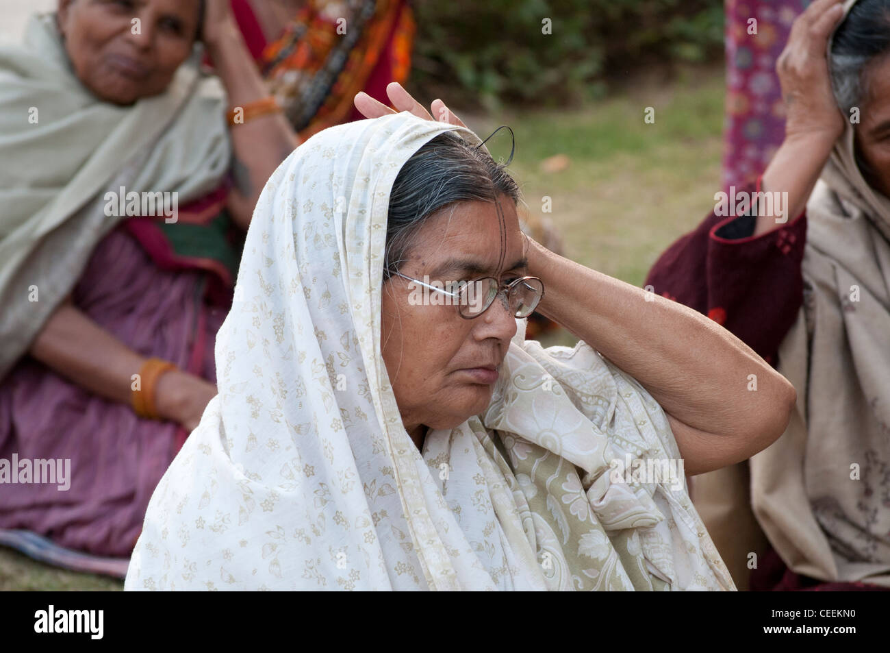 Widows doing yoga, Ma Dham Ashram, run by NGO Guild of Service, Vrindavan, Uttar Pradesh, India Stock Photo