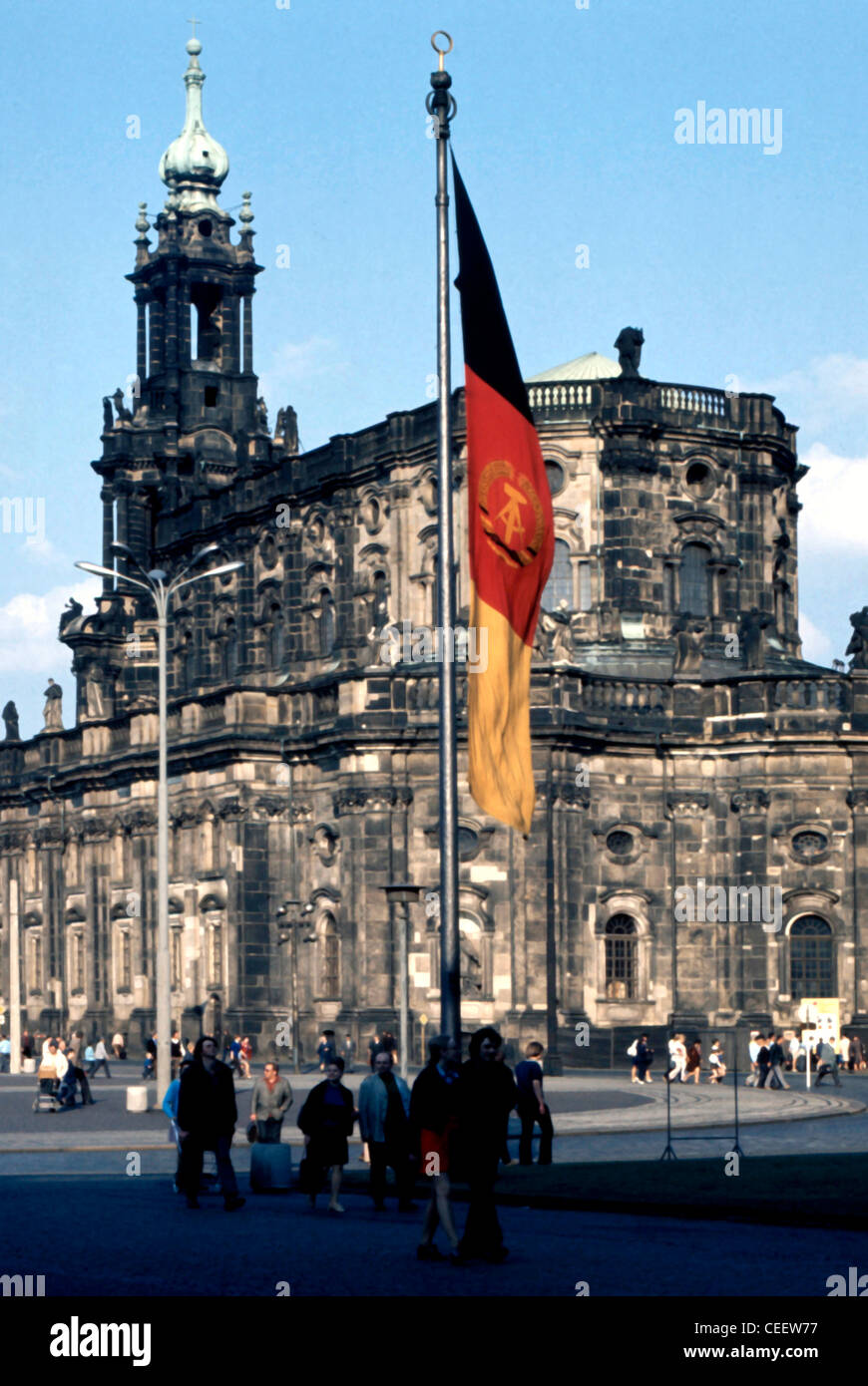 Dresden 1973: Catholic church Hofkirche with the National flag and the emblem of the GDR. Stock Photo