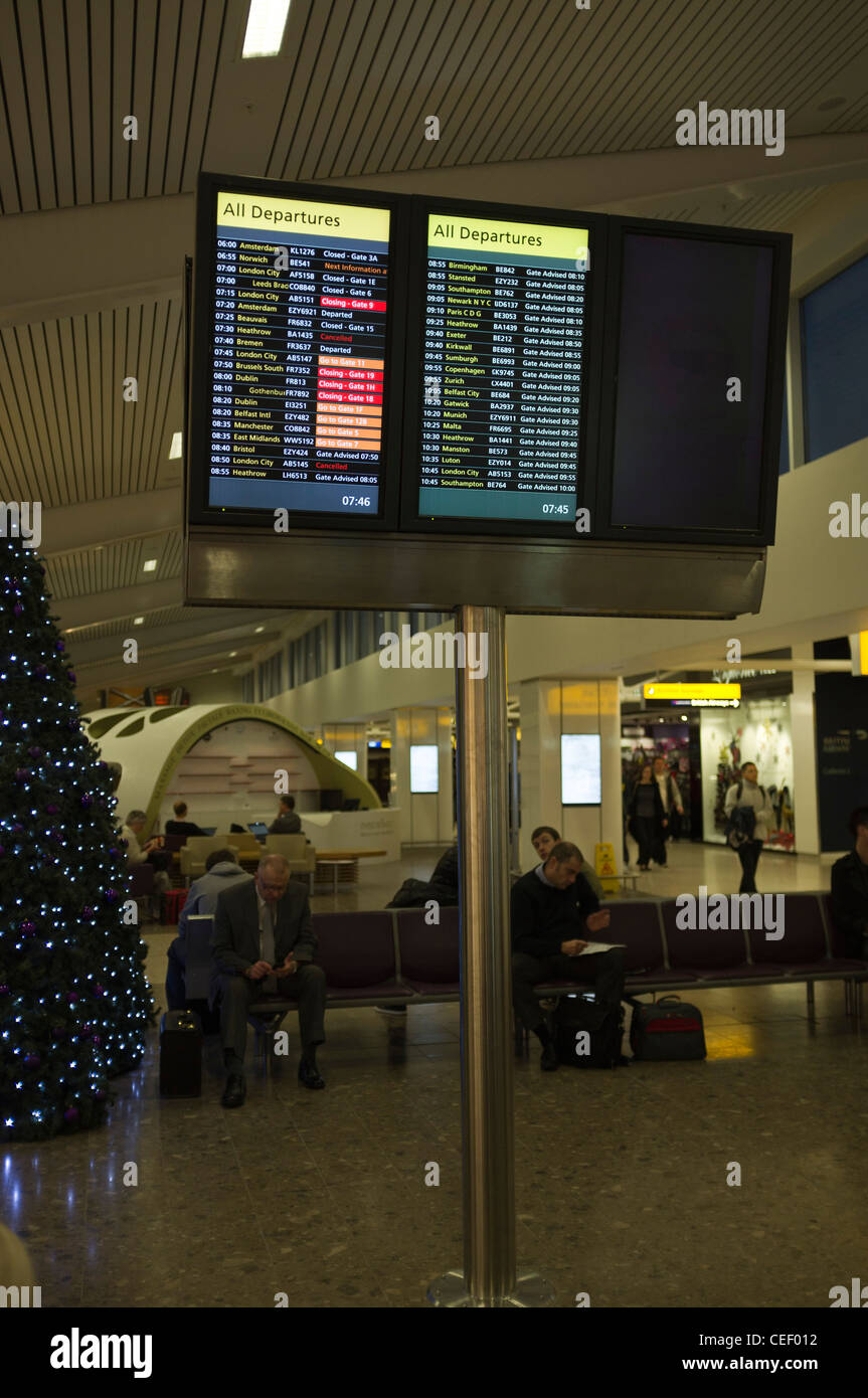 dh  EDINBURGH AIRPORT EDINBURGH Airport flight departures board and passengers waiting arrivals departure Stock Photo