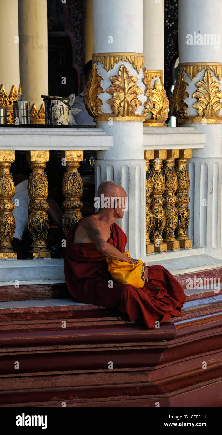 red robed buddhist monk meditate meditation Shwedagon Pagoda Myanmar Burma Yangon Rangoon Stock Photo