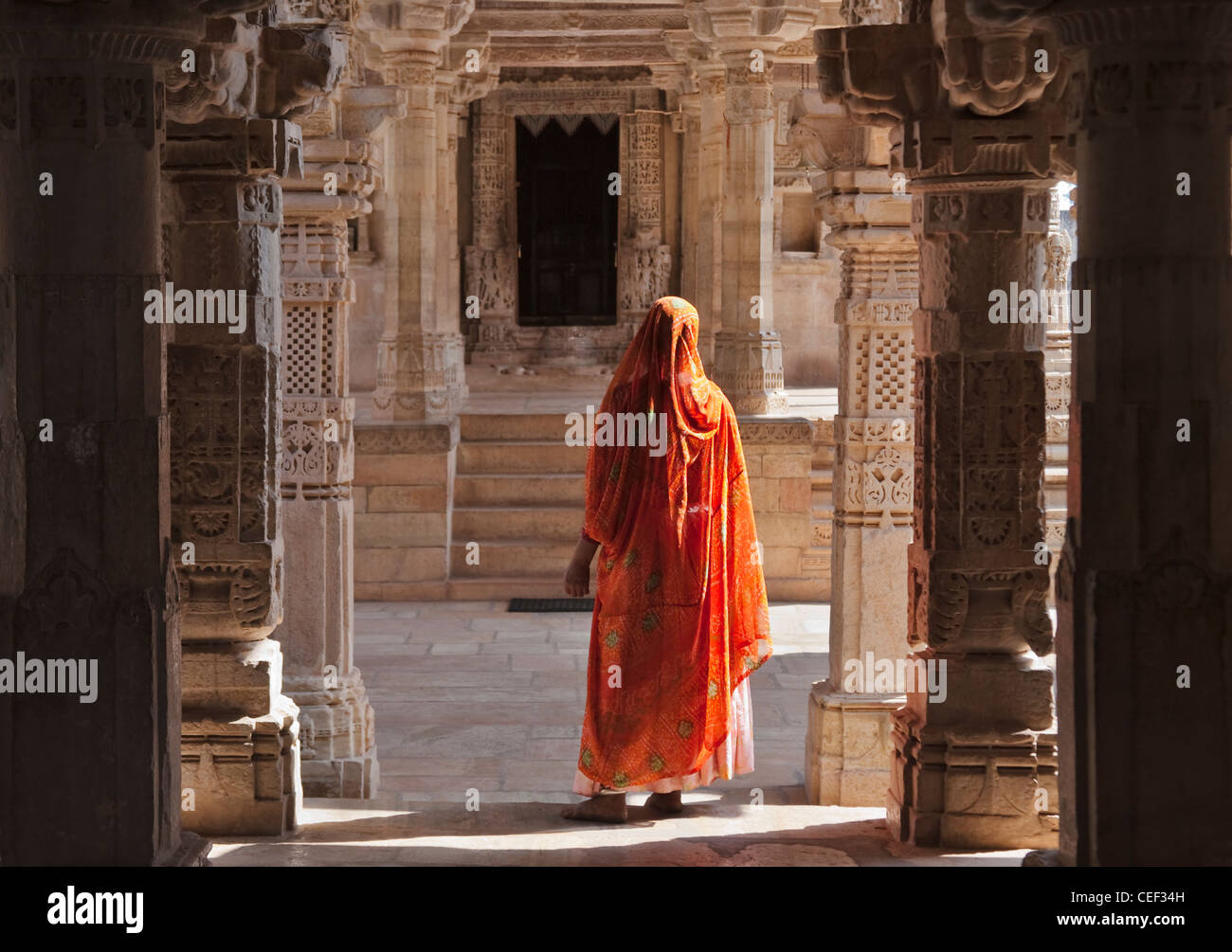 Woman in Jain Temple in Chittorgarh Fort, Rajasthan, India Stock Photo