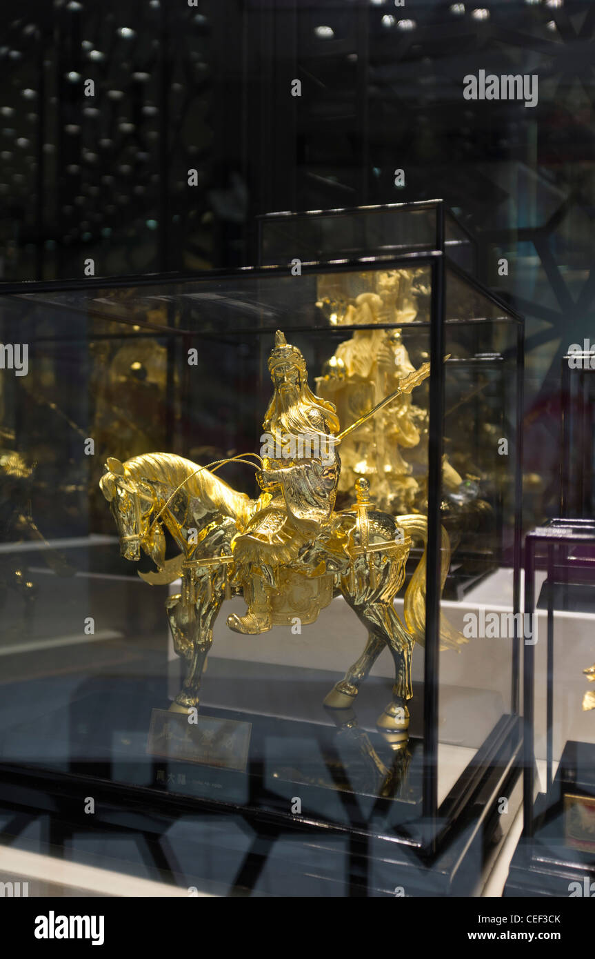 dh Chow Tai Fook Jewellery CAUSEWAY BAY HONG KONG Chinese gold statue buying shop window display far east China luxury goods Stock Photo