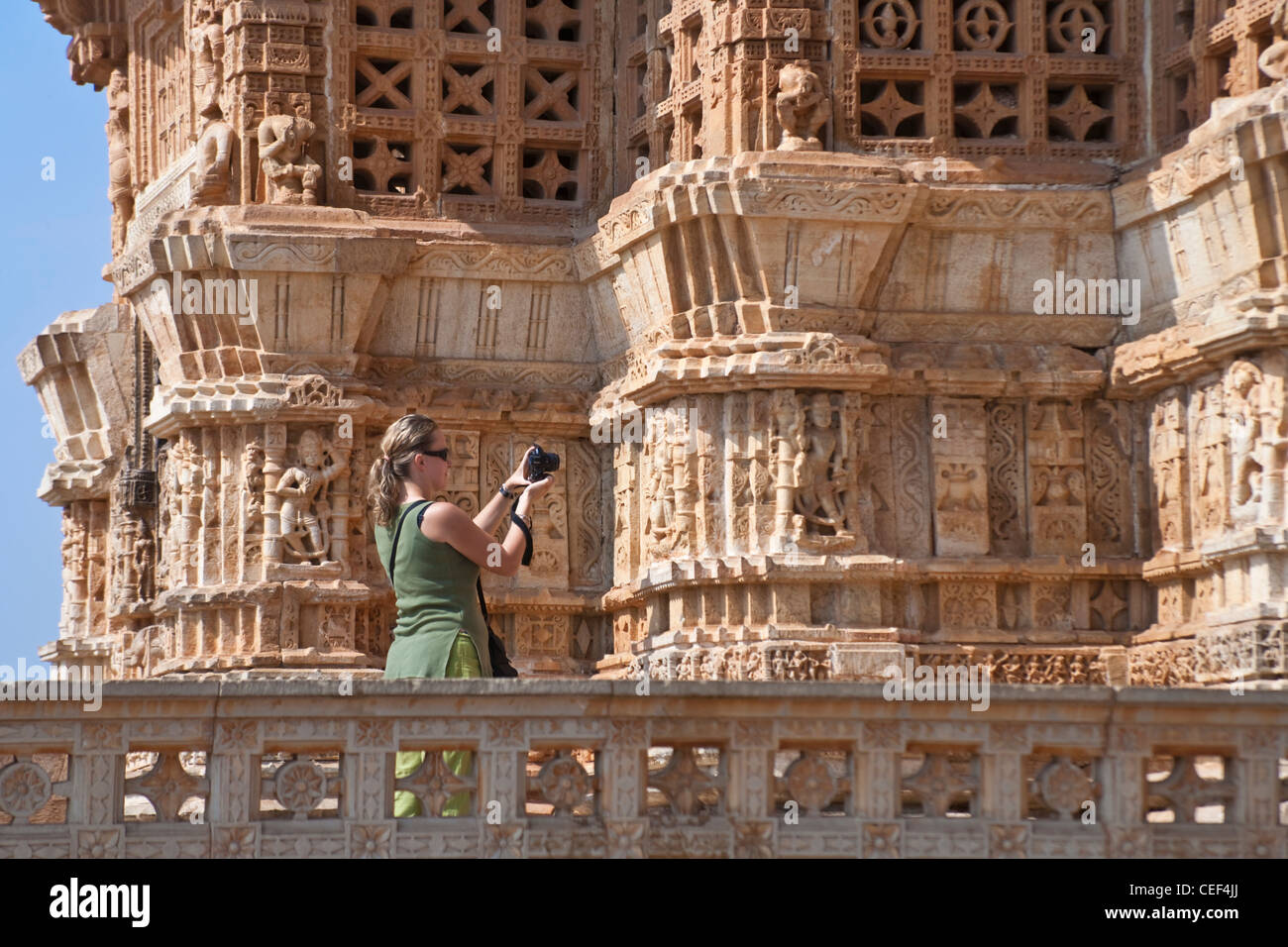 Tourist photographing the Jain temple in Chittorgarh Fort, Rajasthan, India Stock Photo