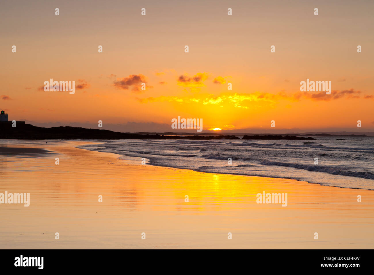 Sunrise at Bamburgh Beach on a spring morning, Northumberland, England. Stock Photo