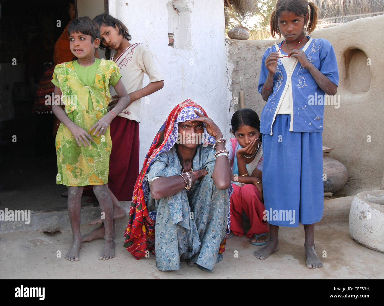 Family before their home, Rajasthan, India Stock Photo