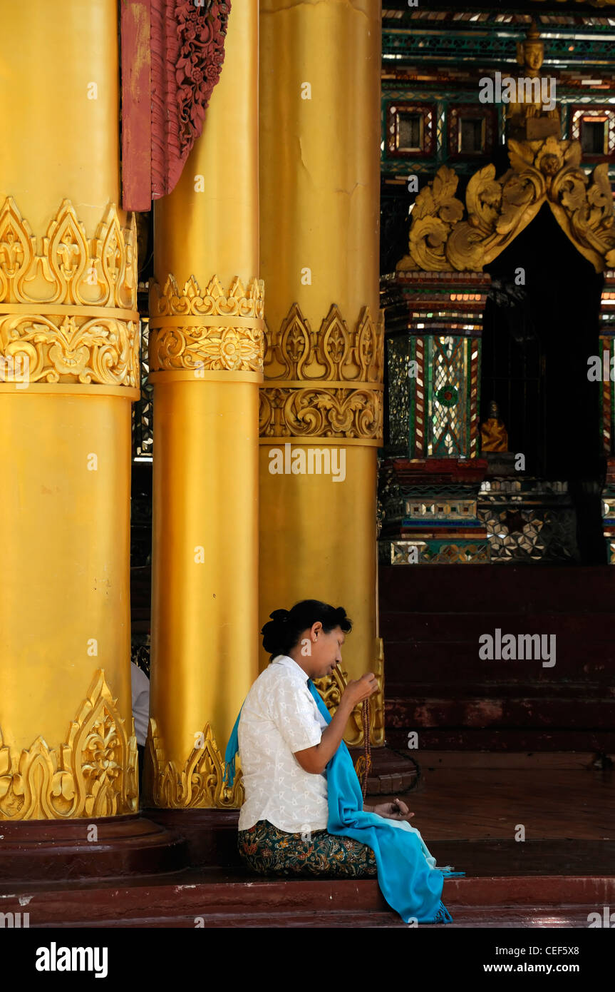 woman pray praying meditate meditating buddhist shrine buddhism