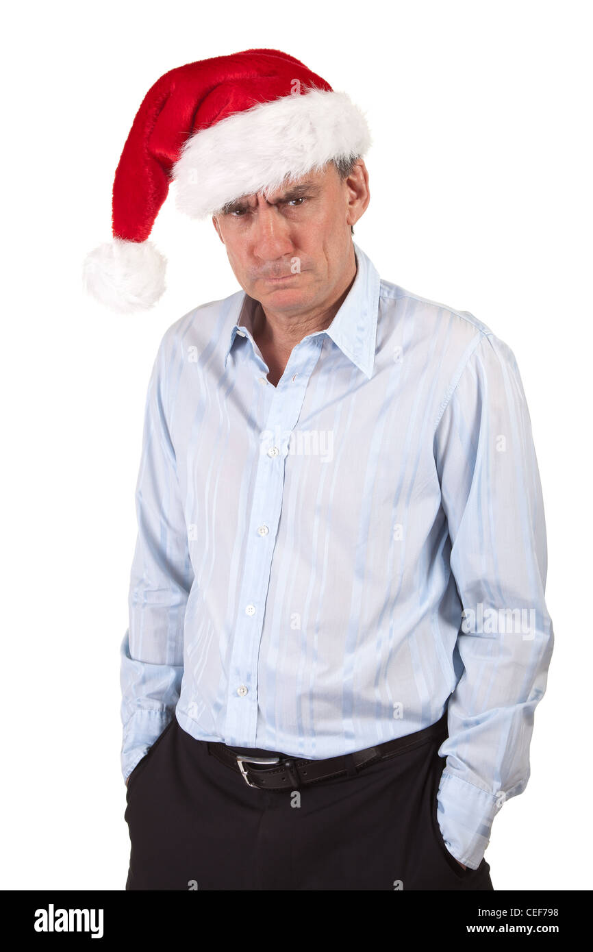 Portrait of Grumpy Frowning Angry Business Man in Christmas Santa Hat Bah Humbug Stock Photo