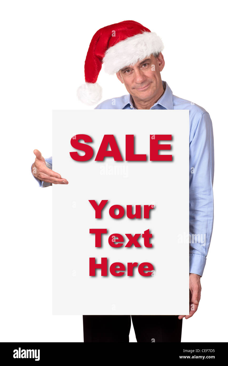 Attractive Man in Santa Hat Holding Blank White Sign Stock Photo