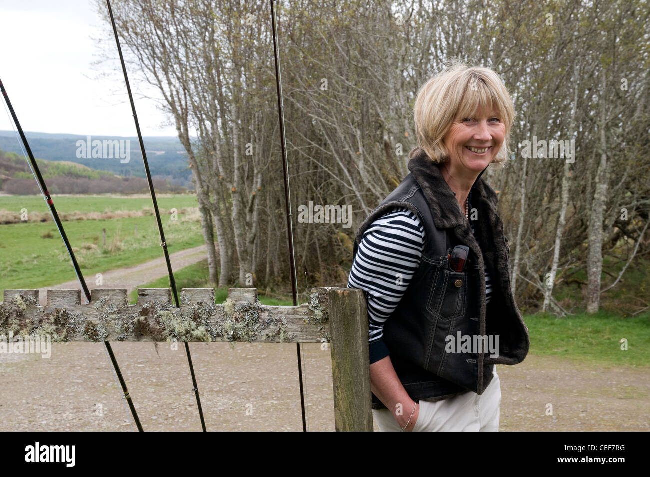 Portrait of a woman on the banks for the River Oykel, Sutherland, Scotland, UK Stock Photo