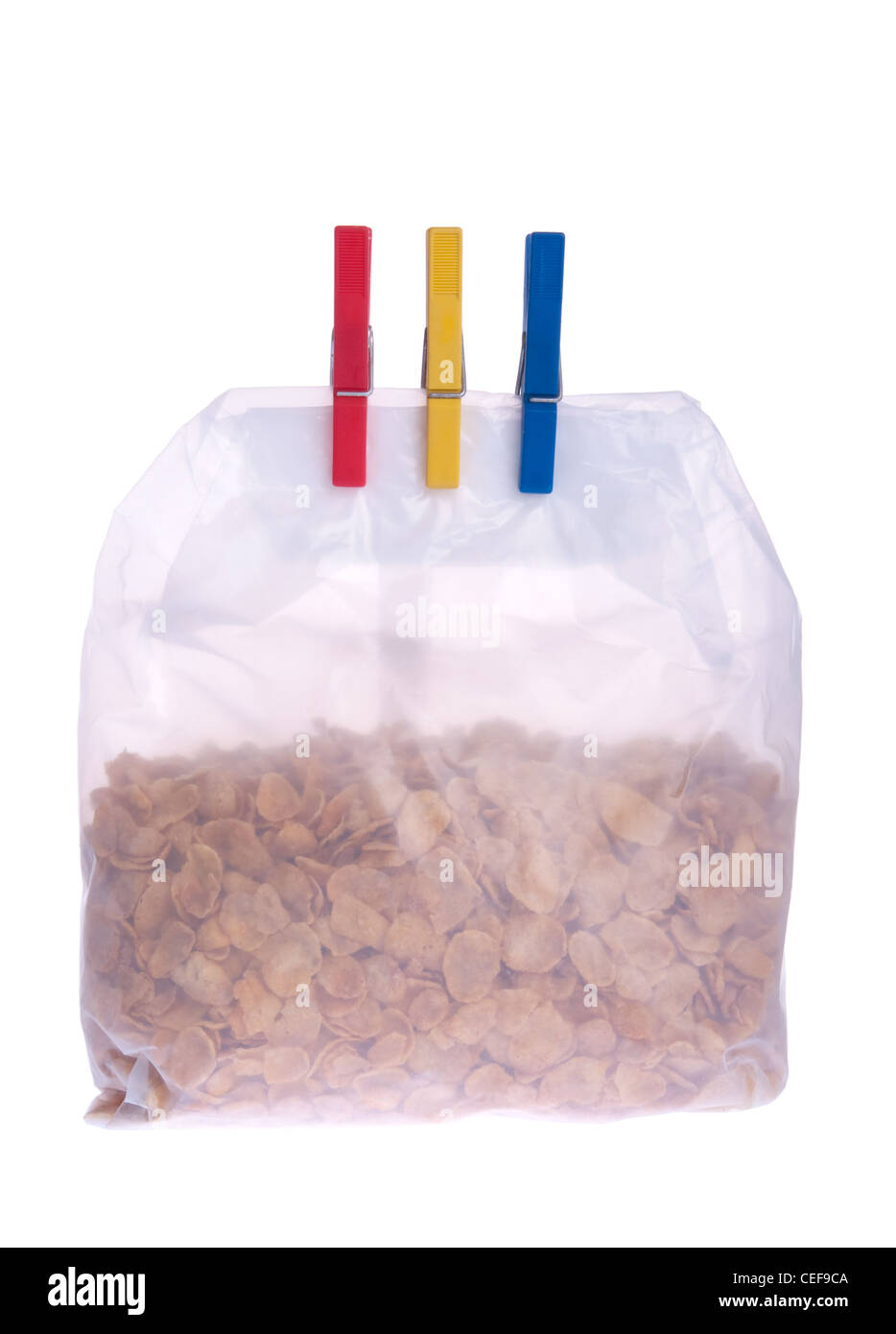 Cornflakes bag with clothes pegs Stock Photo