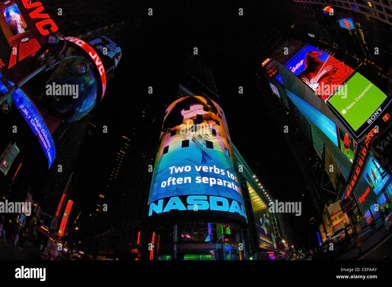 Times square past midnight with Neon signs, Manhattan, New York Stock Photo