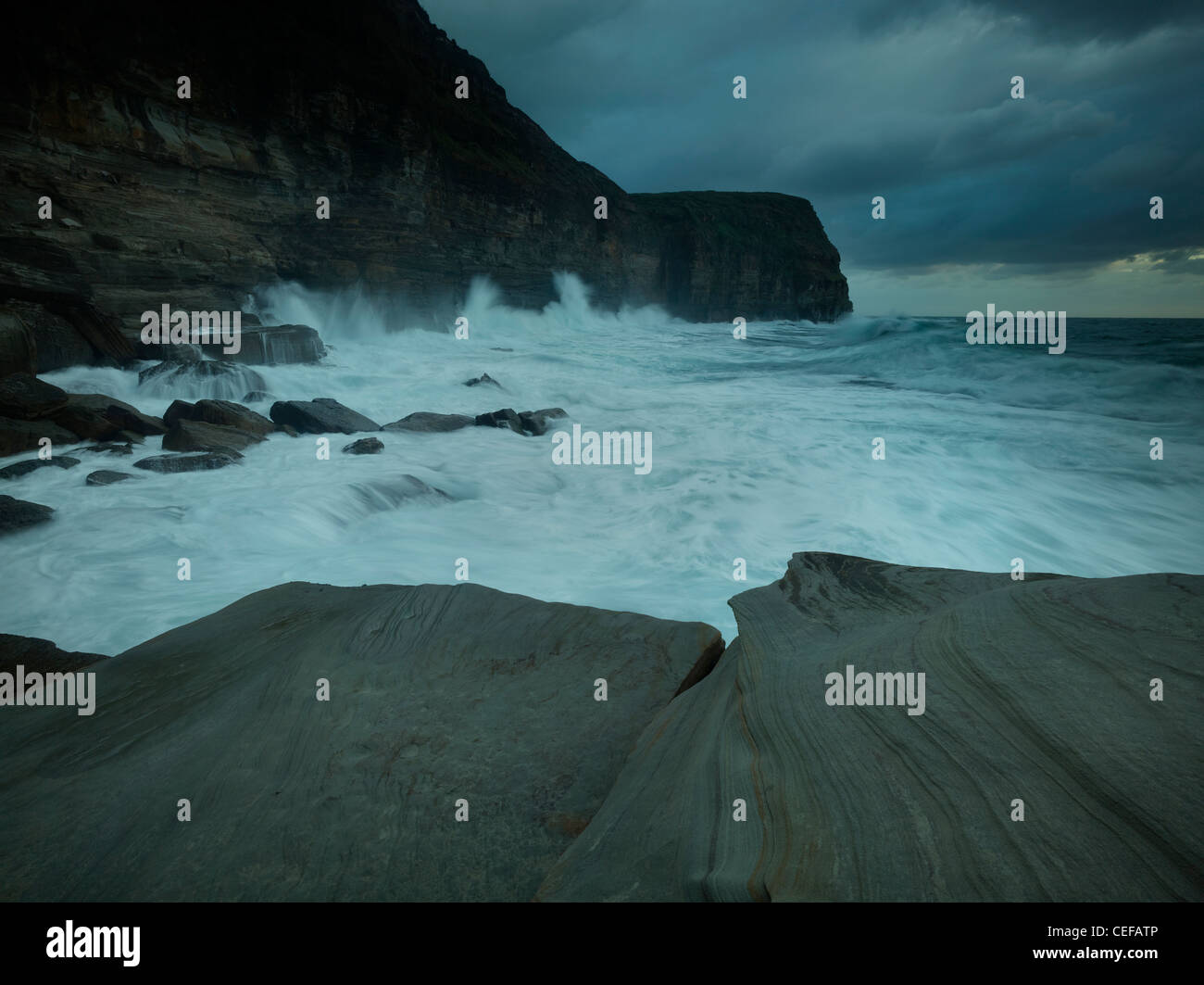 Tempestuous seas smashing again headland, Bouddi National Park, NSW Australia Stock Photo