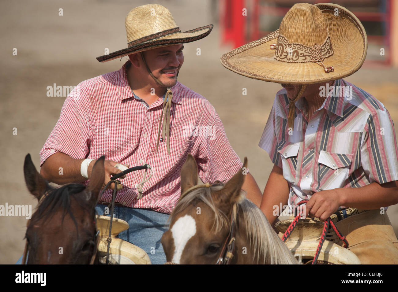 Mexican charros horsemen chatting in sombreros, Texas, US Stock Photo
