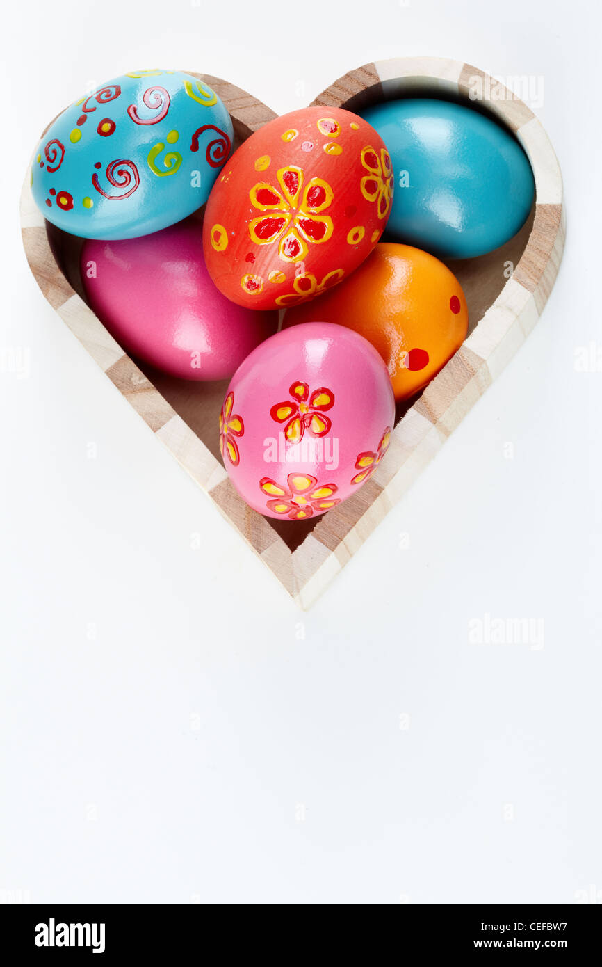 Heart shaped box full of colorful Easter eggs Stock Photo