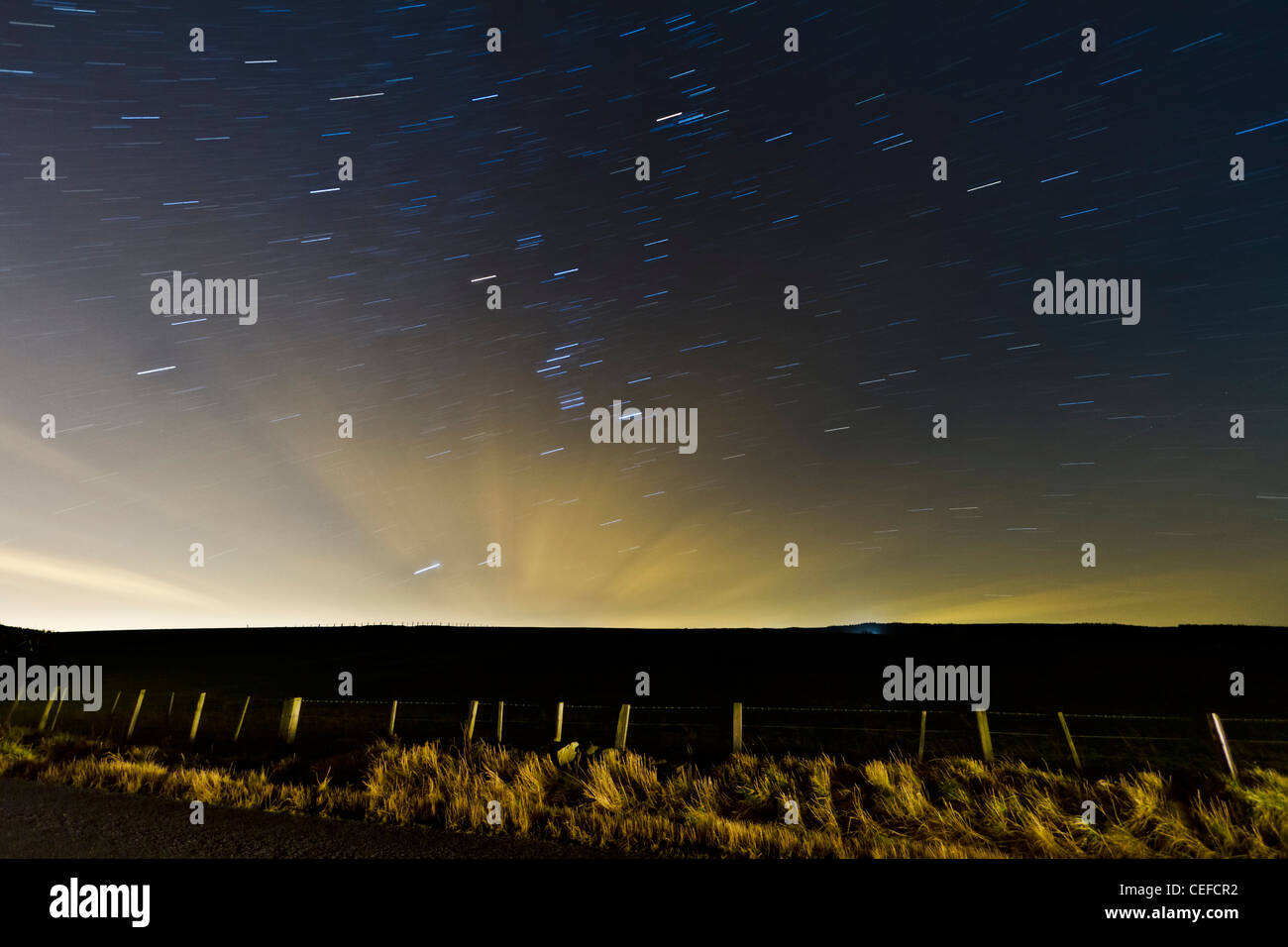 Star trails in a rural location in Northumberland, England Stock Photo